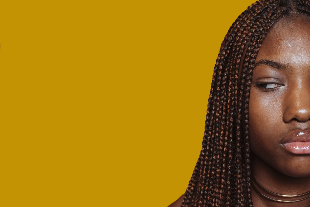 Closeup cropped front half face portrait of beautiful african teenage girl