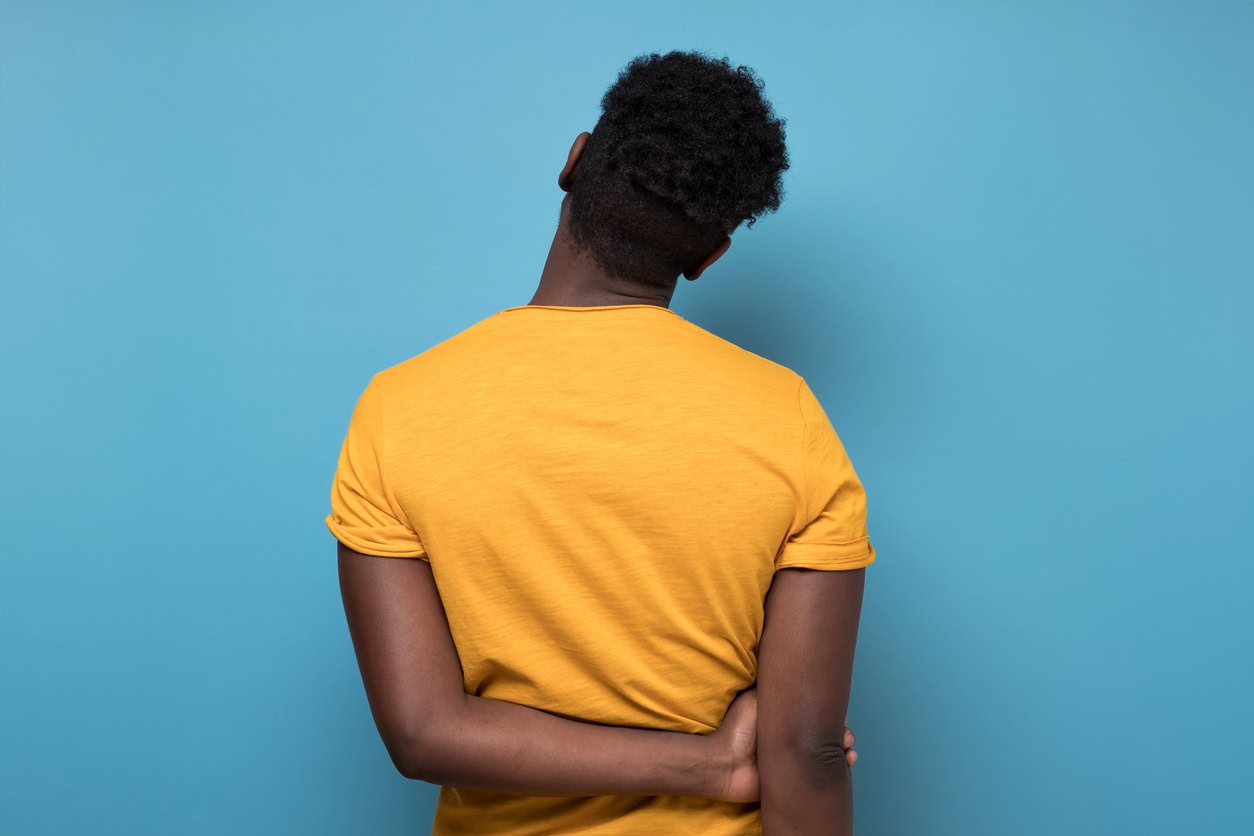 one african american man portrait turning backside being sad despair or lonely