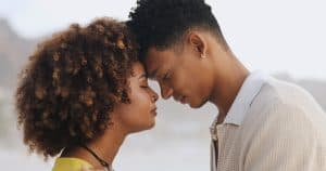 Outdoor, love and couple with forehead touch, peace or gesture of connection, bonding or respect. Nature, woman and man with trust in relationship, comfort or commitment of support or date